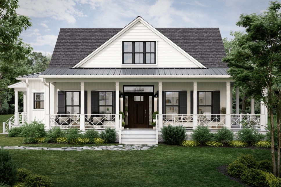 White and gray house with a well-kept lawn and windows treated with exterior window shutters.