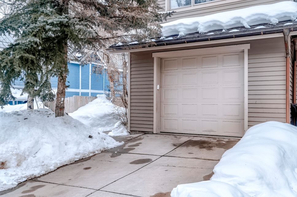 A driveway with snow cleared out.